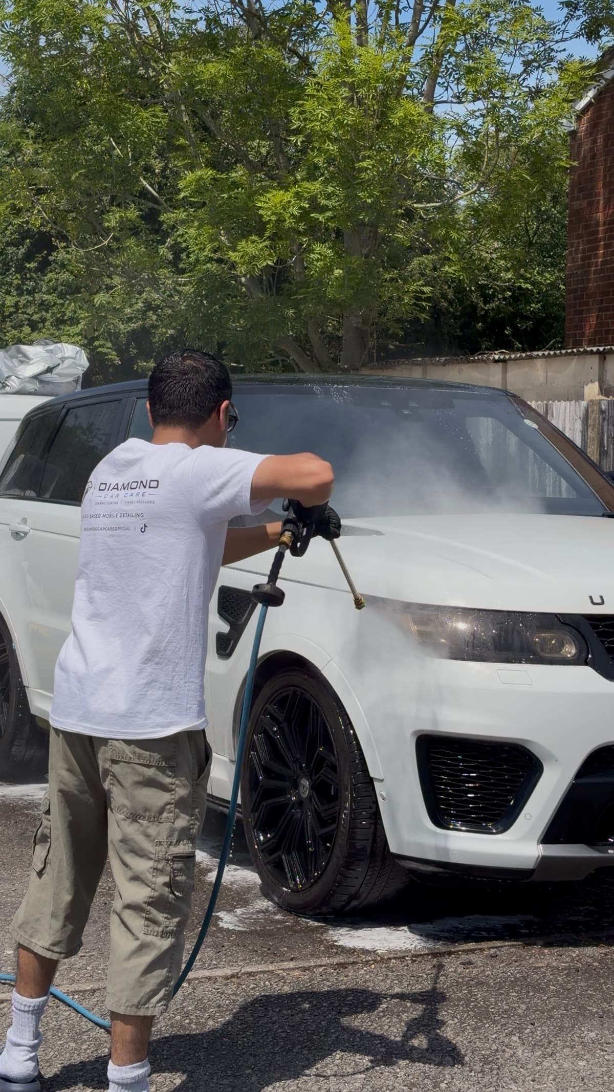 Detailing in progress on the front wheel of the Range Rover Sport